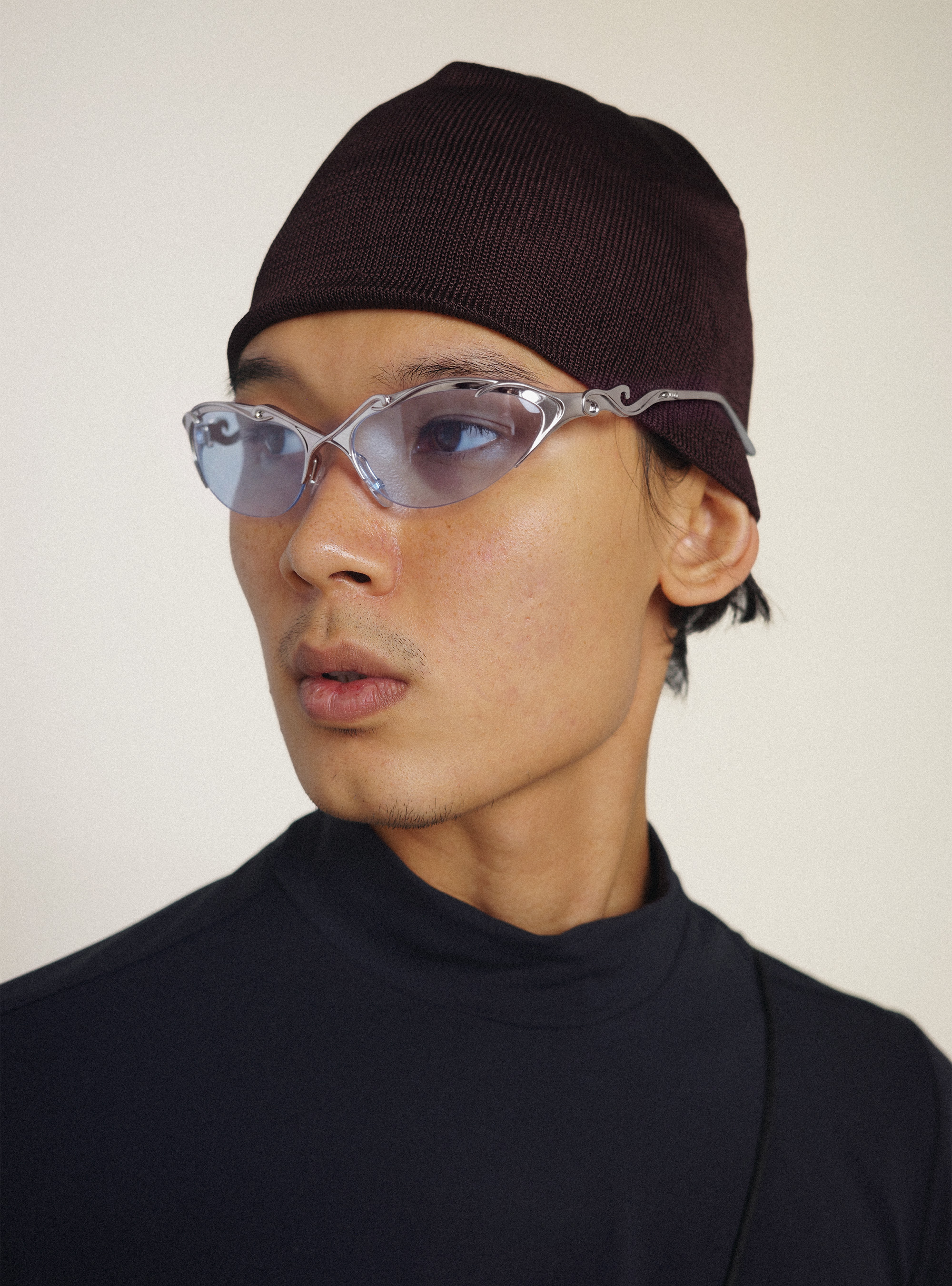 OMOTE AIR worn with a dark knit hat